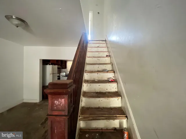 an empty room with wooden floor