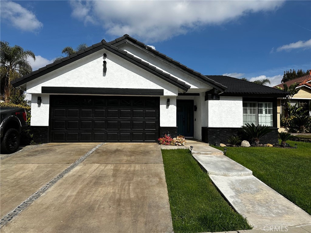 6 Quiet Hollow Road Phillips Ranch, CA 91766 - Photo 1 of 1 a front view of a house with a yard