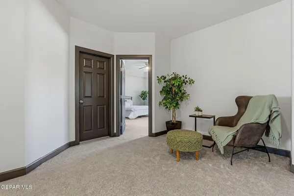 a bedroom with a bed and a ceiling fan