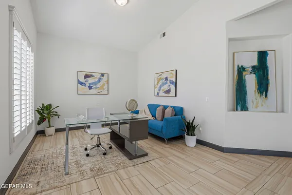 a living room with furniture and a table