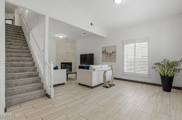 a living room with furniture and a flat screen tv