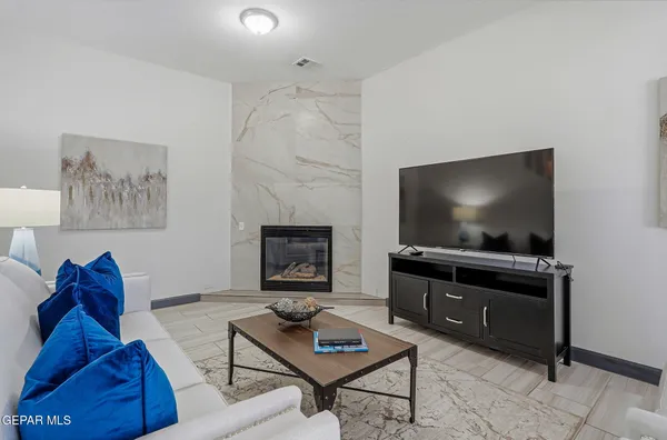 a living room with furniture and a flat screen tv