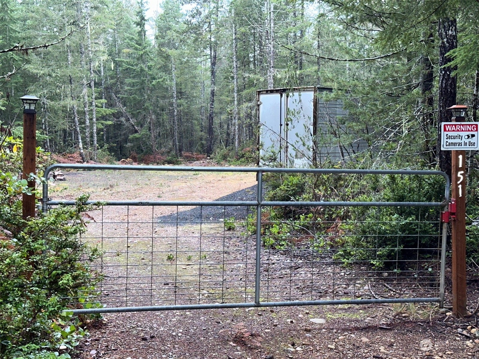 151 Northeast Bedrock Road Belfair, WA 98528 - Photo 4 of 27 a view of a wooden building
