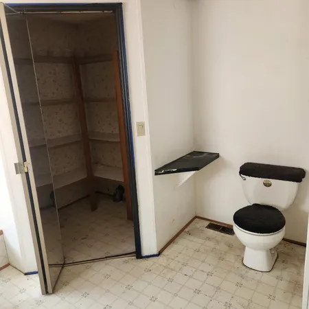 a view of a storage & utility room with a sink