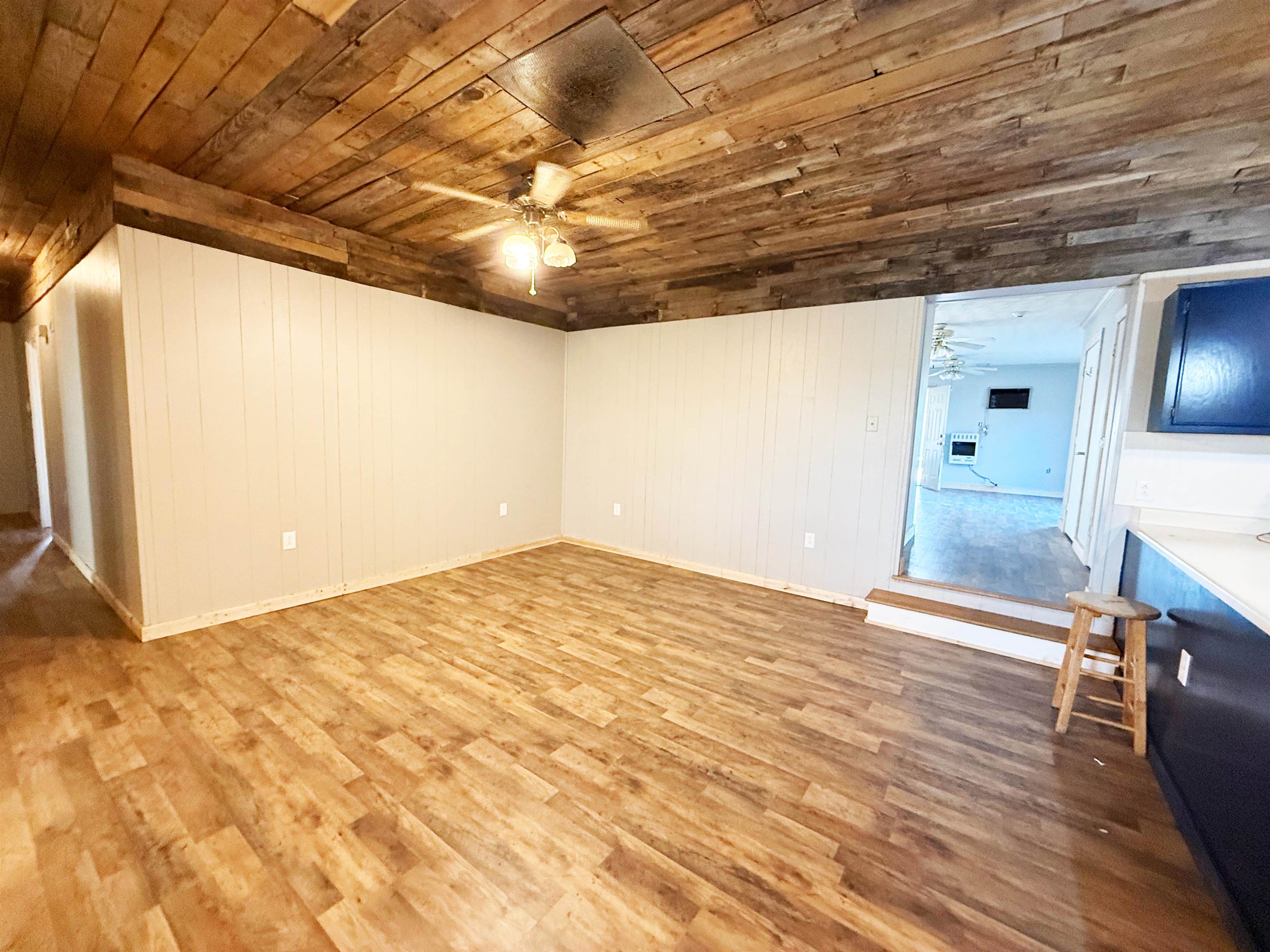 2142 Highway 70 Mason, TN 38049 - Photo 13 of 36 Spare room with ceiling fan, wood finished floors, and wooden ceiling