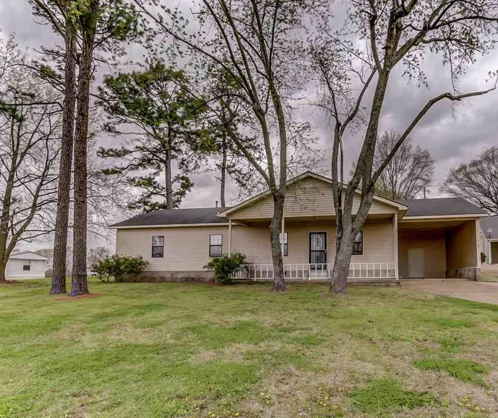 2142 Highway 70 Mason, TN 38049 - Photo 2 of 36 Single story home with an attached carport, concrete driveway, a front lawn, and covered porch