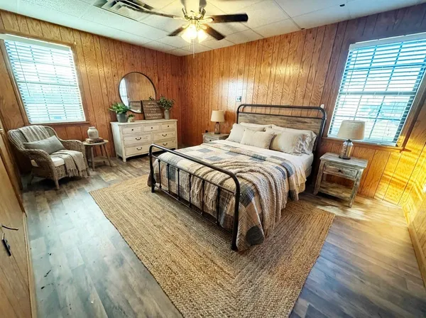 a bathroom with a tub and shower curtain