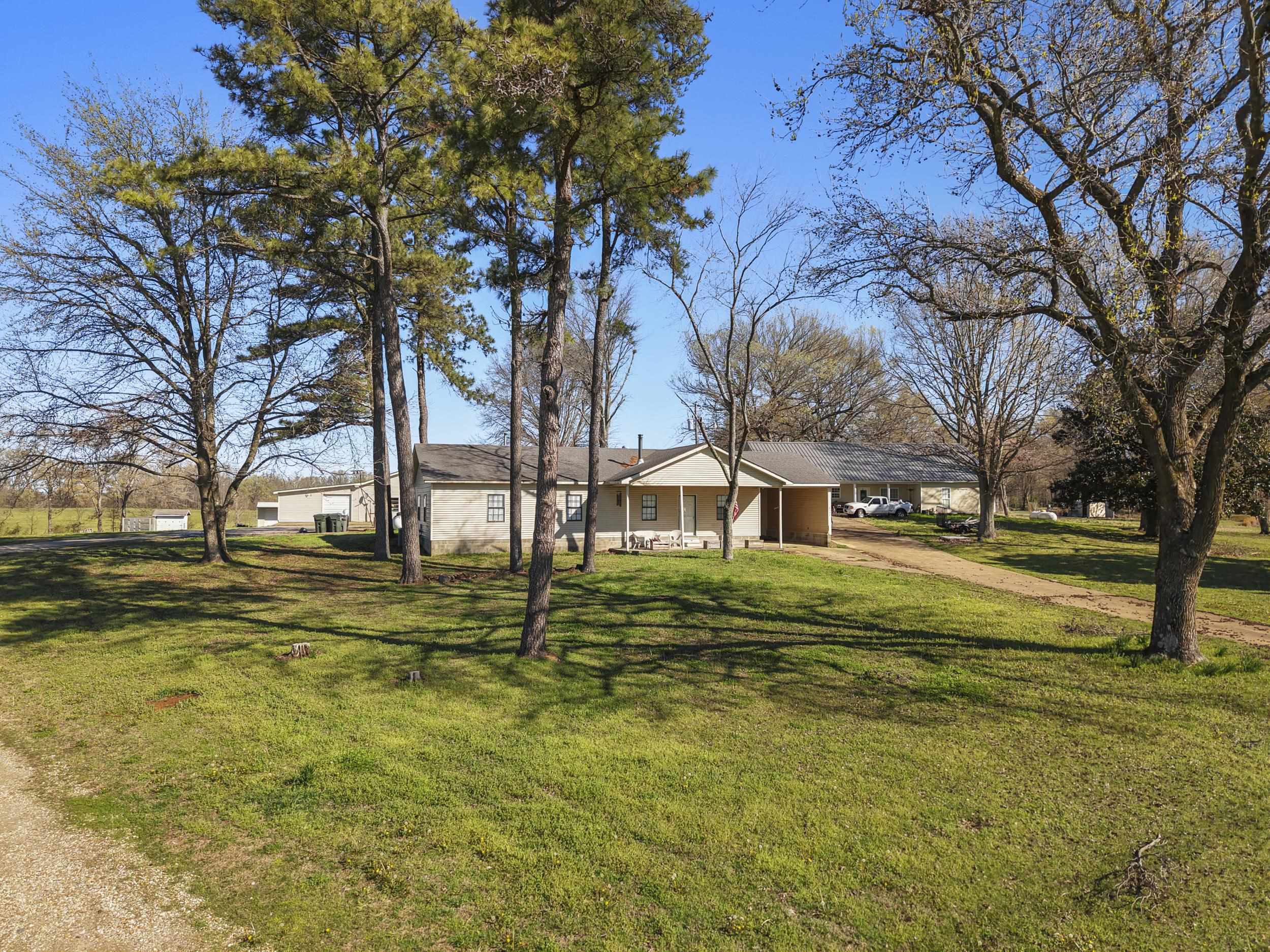 2142 Highway 70 Mason, TN 38049 - Photo 3 of 38 Ranch-style home with a front lawn, an attached carport, and driveway
