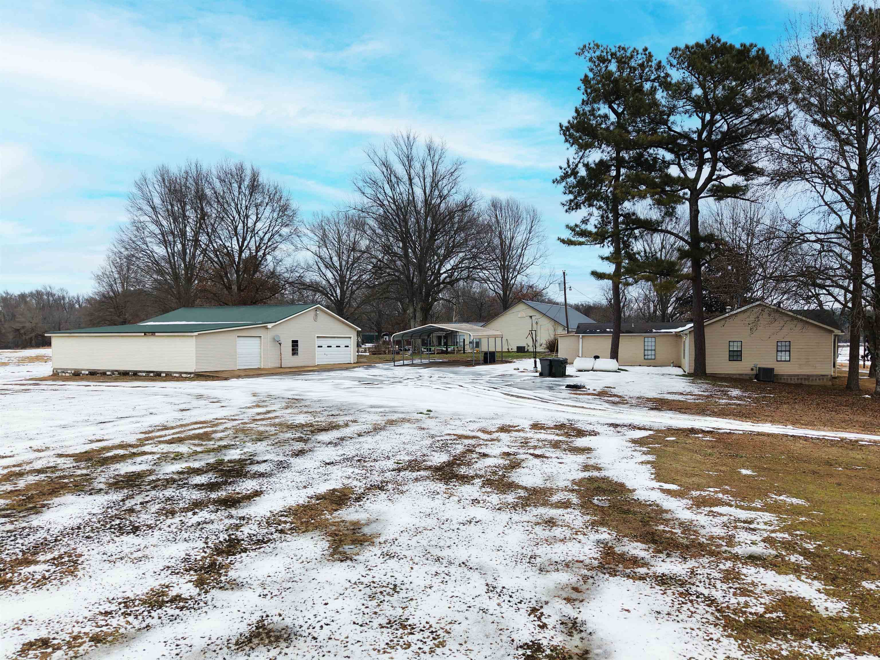 2142 Highway 70 Mason, TN 38049 - Photo 32 of 36 Snow covered property featuring a residential view and a cooling unit