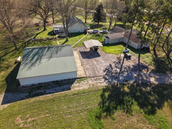 a living room with furniture a rug and a chandelier