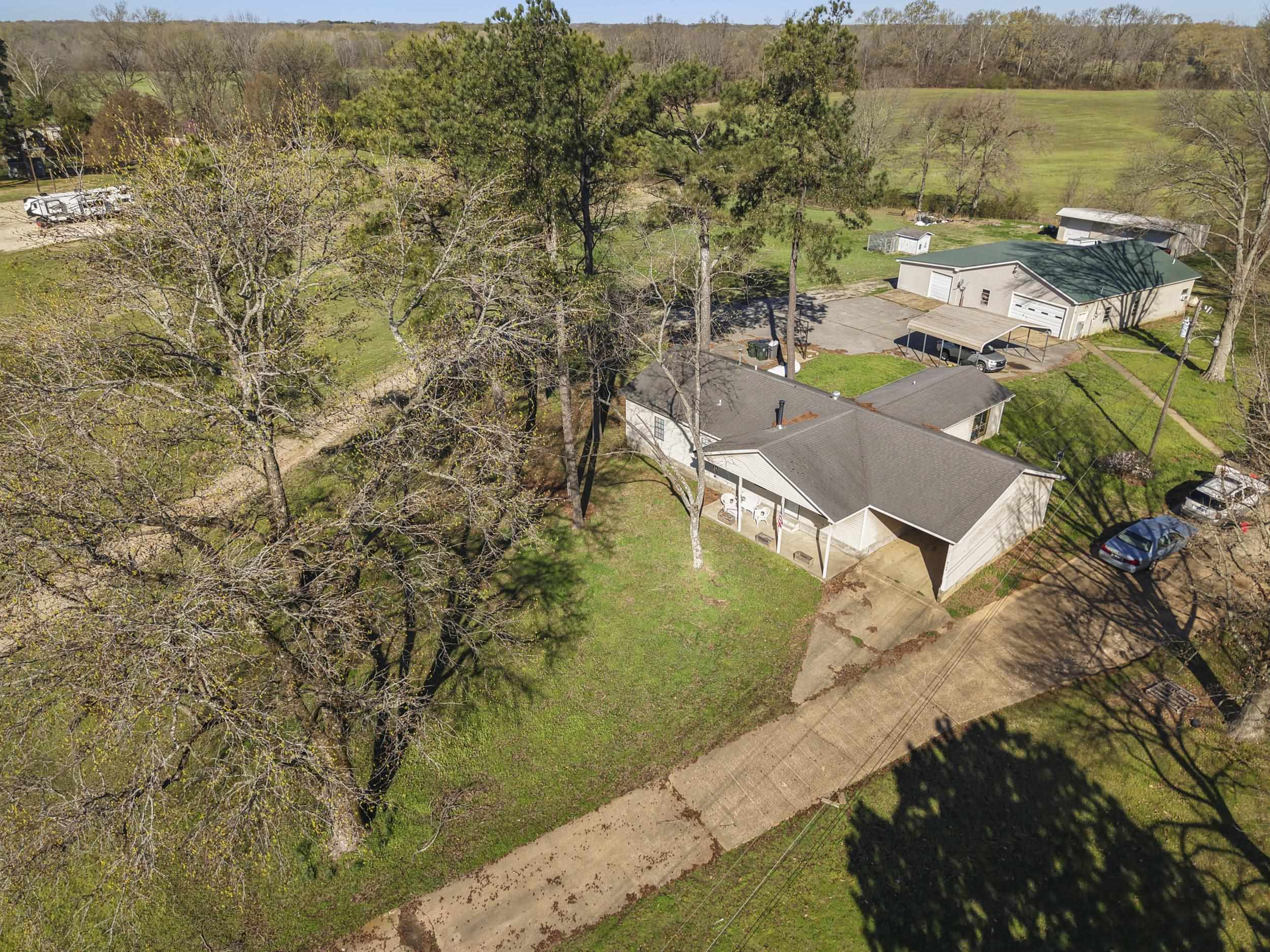 2142 Highway 70 Mason, TN 38049 - Photo 37 of 38 Aerial view of a tree filled landscape