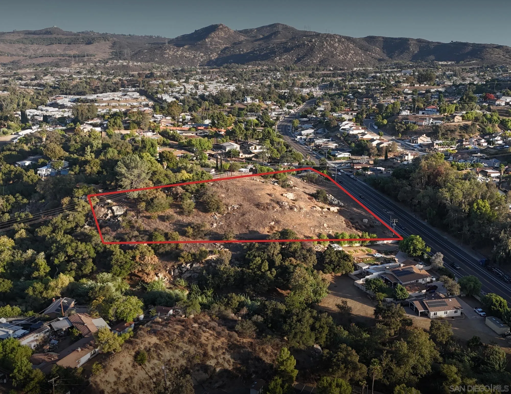 an aerial view of residential house and car parked