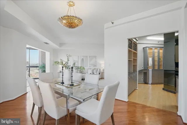 a kitchen with kitchen island granite countertop a sink appliances and cabinets