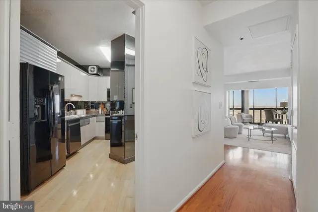 a bathroom with a tub a sink and a large mirror