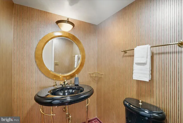 a bathroom with a shower and a glass door