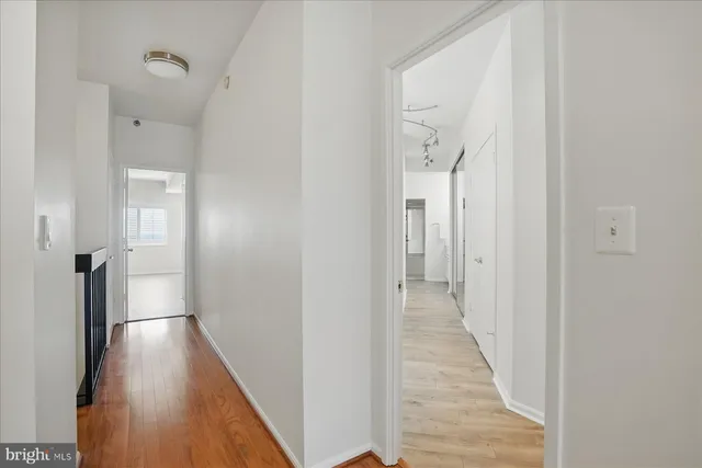 a spacious bathroom with a double vanity sink mirror and shower
