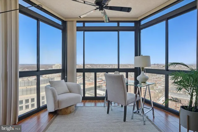 a balcony with furniture and a window