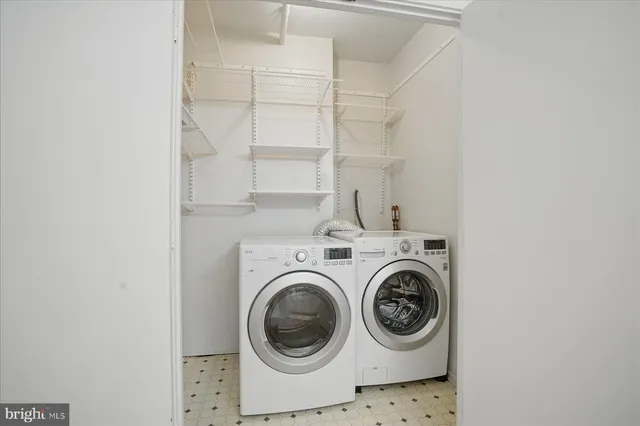 a living room with fireplace furniture and a wooden floor