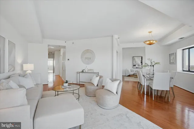 a living room with furniture and a table