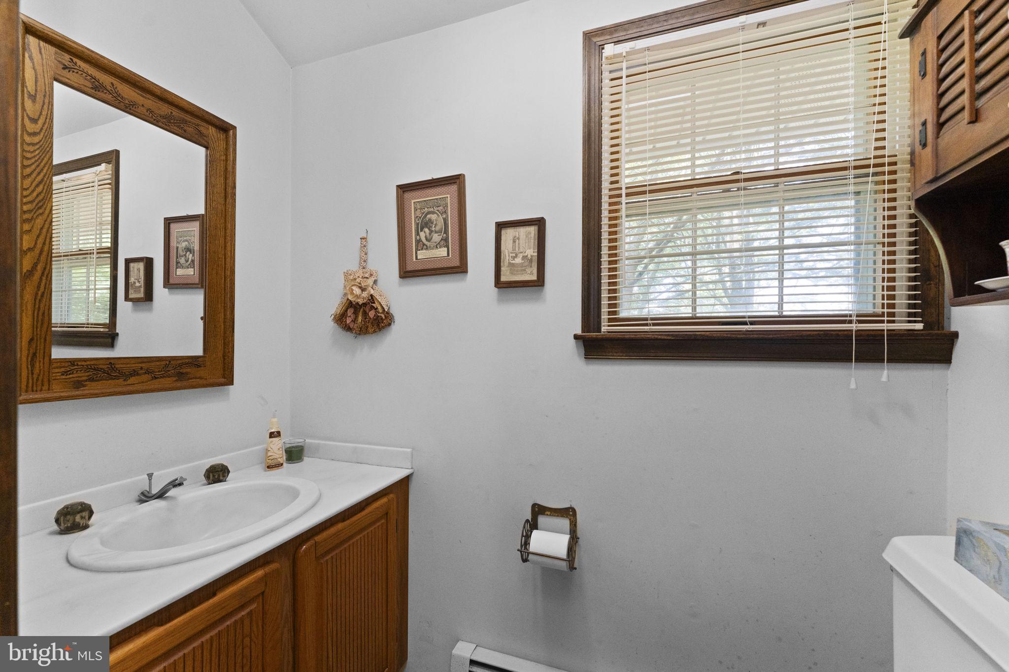 215 Bethel Road Spring City, PA 19475 - Photo 11 of 29 a bathroom with a sink and a window
