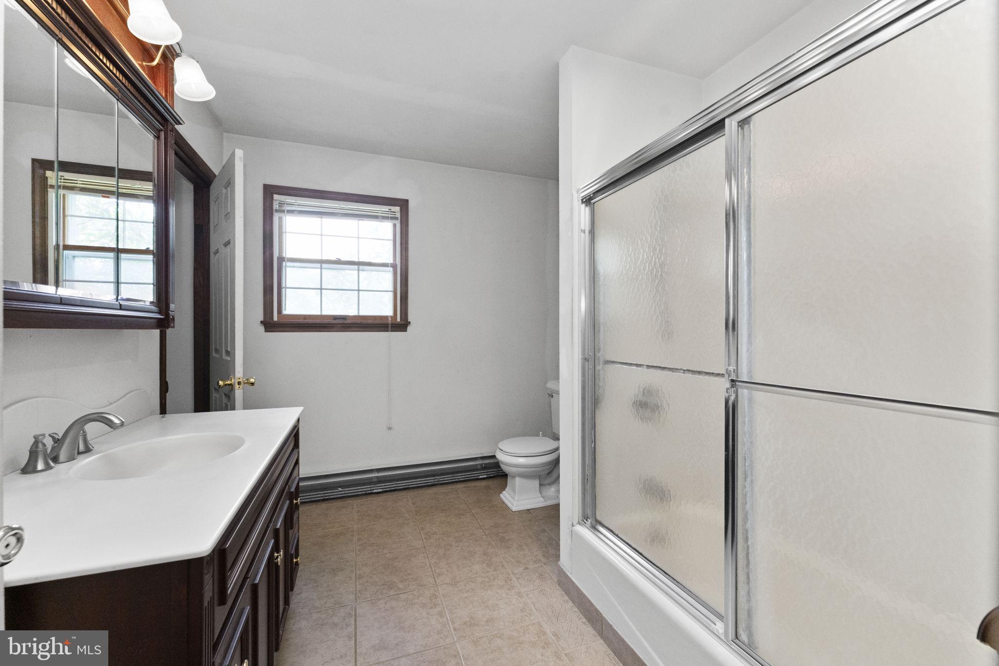 215 Bethel Road Spring City, PA 19475 - Photo 14 of 29 a bathroom with a sink and a mirror