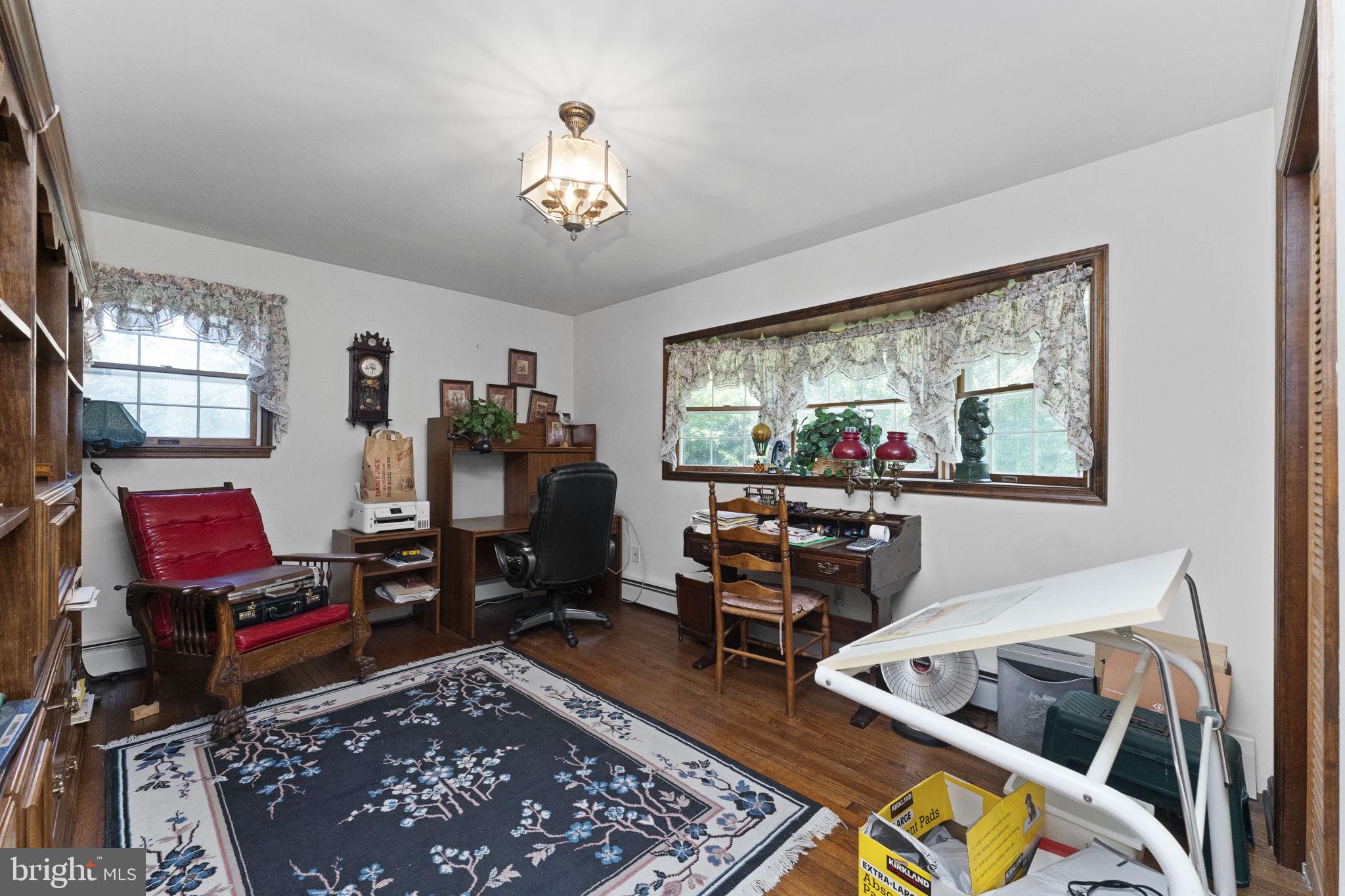 215 Bethel Road Spring City, PA 19475 - Photo 15 of 29 a living room with furniture and a flat screen tv