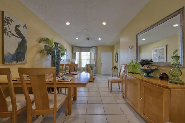 a kitchen with a table and chairs in it