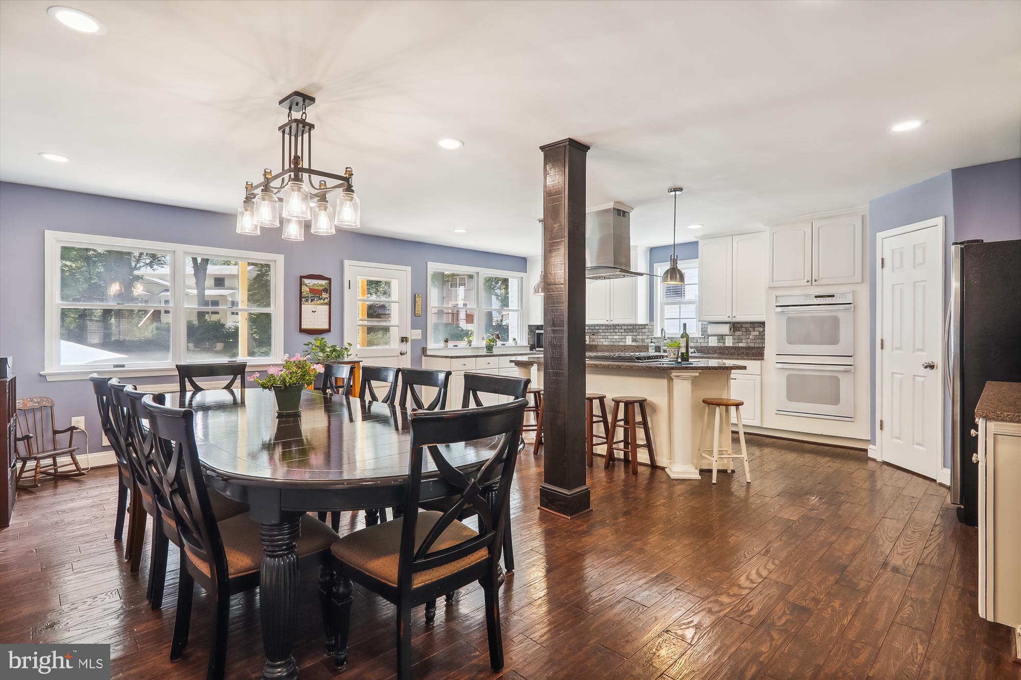 9805 Five Oaks Road Fairfax, VA 22031 - Photo 12 of 70 a dining room with furniture a chandelier and wooden floor
