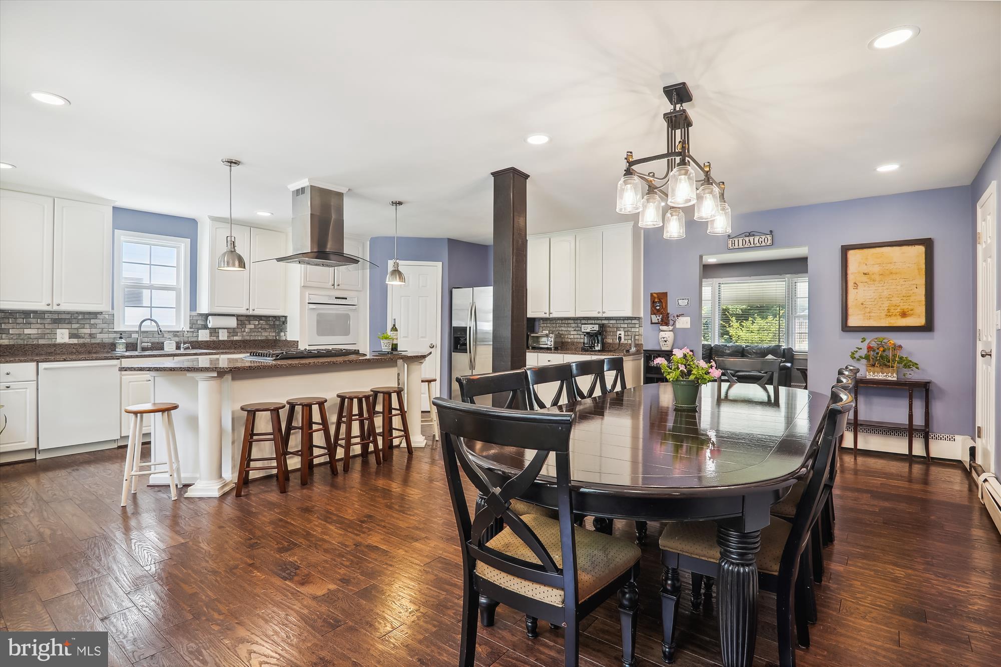 9805 Five Oaks Road Fairfax, VA 22031 - Photo 16 of 70 a view of a dining room with furniture and wooden floor
