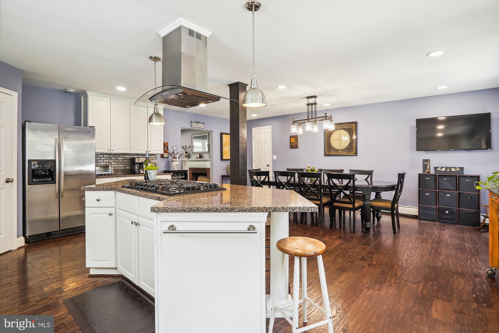 9805 Five Oaks Road Fairfax, VA 22031 - Photo 18 of 70 a kitchen with stainless steel appliances kitchen island granite countertop a large island in the center