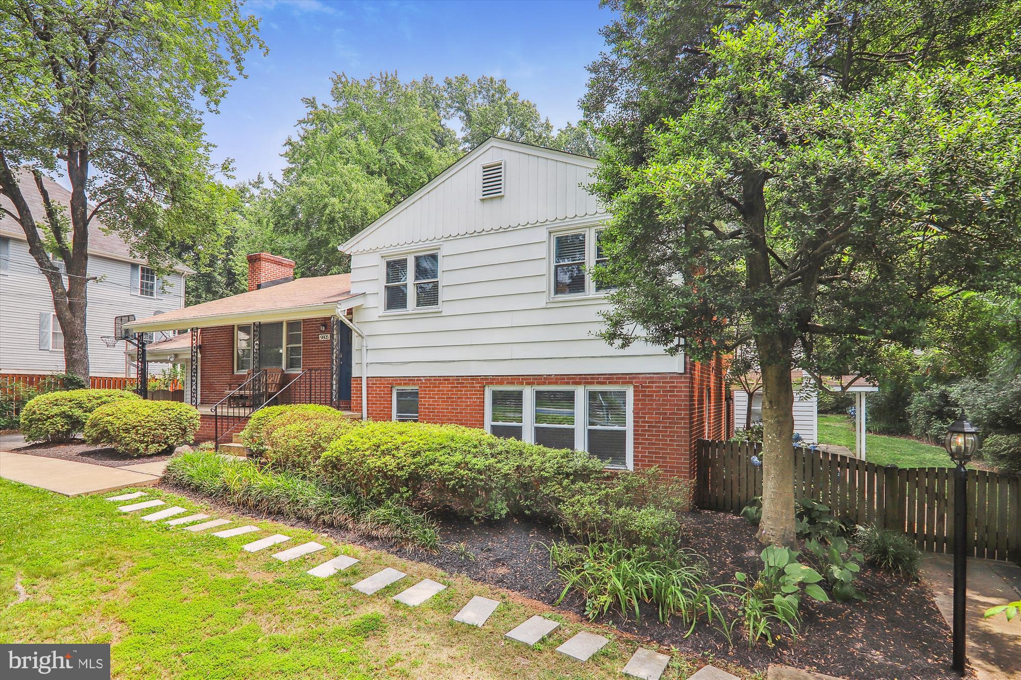 9805 Five Oaks Road Fairfax, VA 22031 - Photo 2 of 70 a front view of a house with a yard