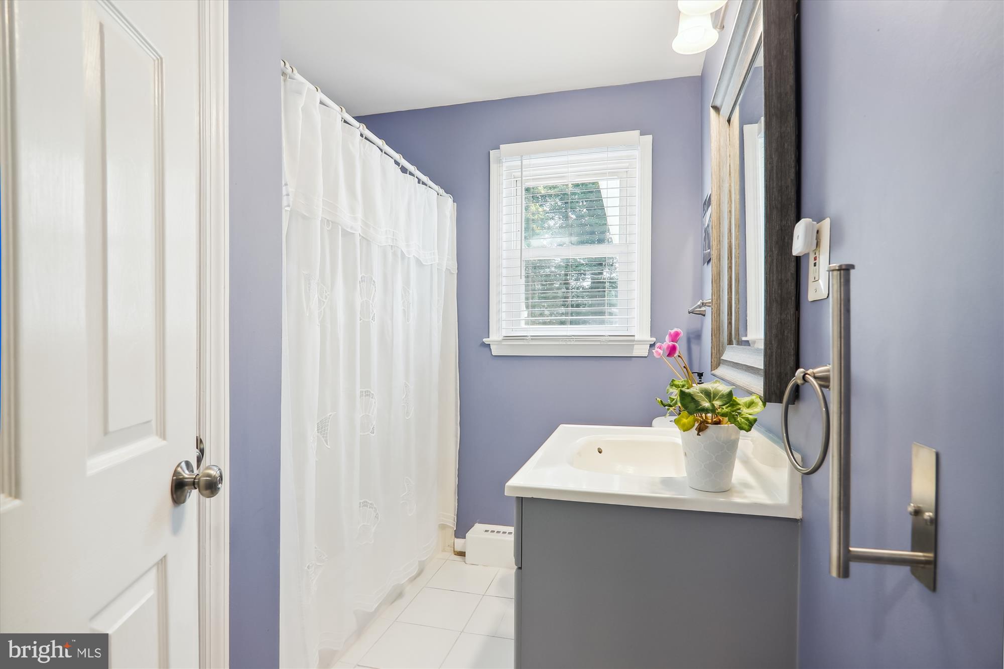 9805 Five Oaks Road Fairfax, VA 22031 - Photo 24 of 70 a bathroom with a sink and a mirror