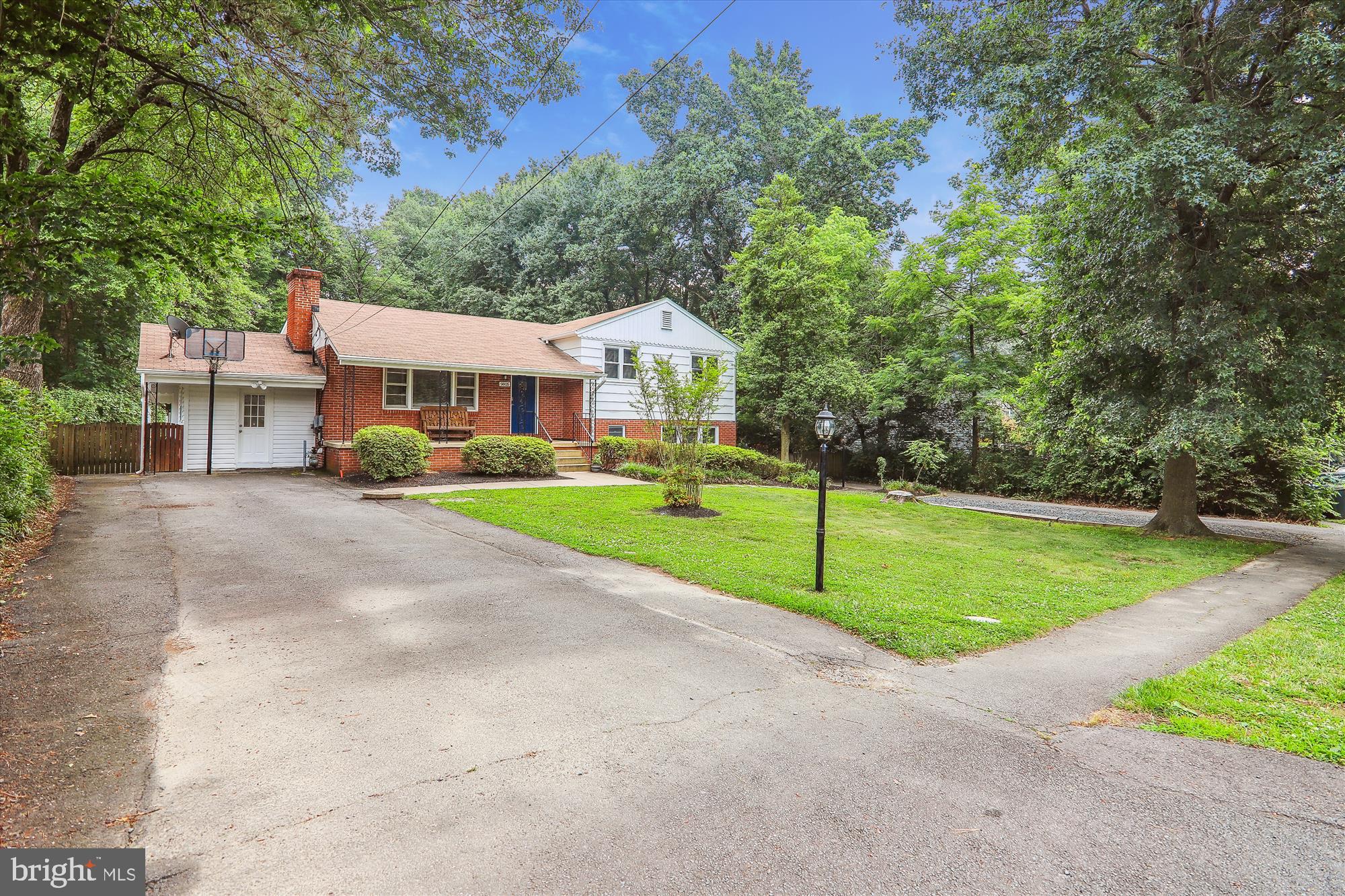 9805 Five Oaks Road Fairfax, VA 22031 - Photo 3 of 70 a view of a house with a big yard and large trees