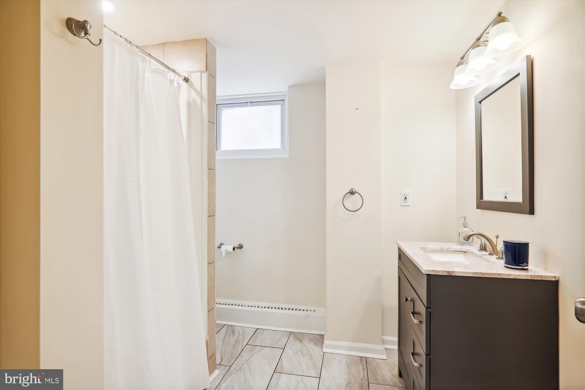 9805 Five Oaks Road Fairfax, VA 22031 - Photo 40 of 70 a bathroom with a sink and a mirror