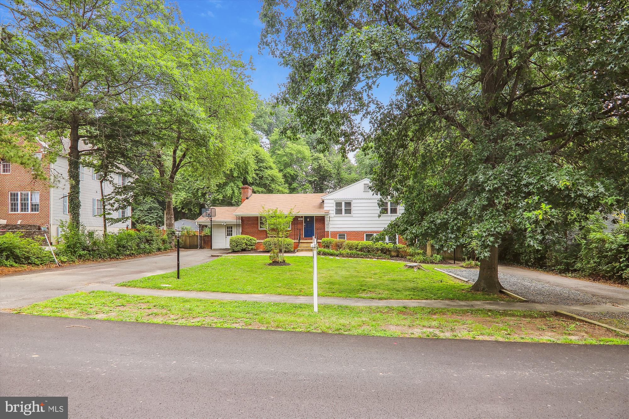 9805 Five Oaks Road Fairfax, VA 22031 - Photo 4 of 70 a view of a house with a big yard and large trees