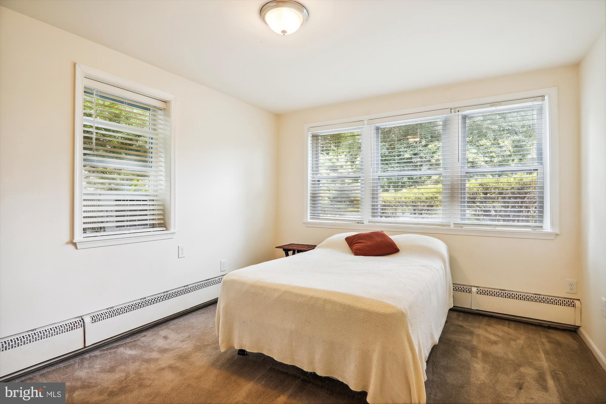 9805 Five Oaks Road Fairfax, VA 22031 - Photo 42 of 70 a bedroom with a bed and a window