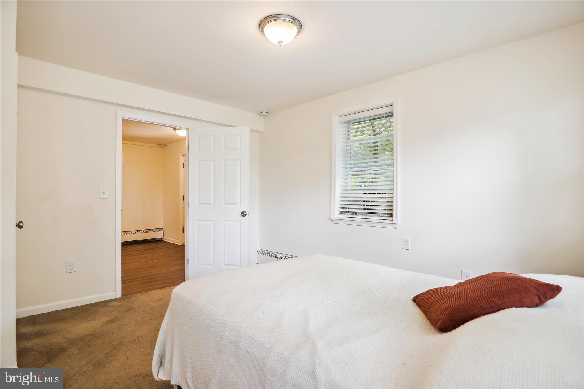 9805 Five Oaks Road Fairfax, VA 22031 - Photo 43 of 70 a bedroom with a bed and a window