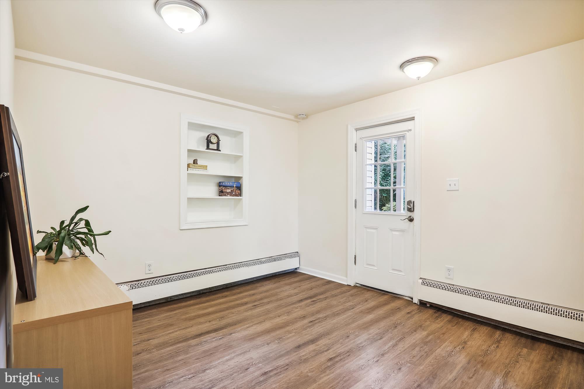 9805 Five Oaks Road Fairfax, VA 22031 - Photo 45 of 70 an empty room with wooden floor and windows