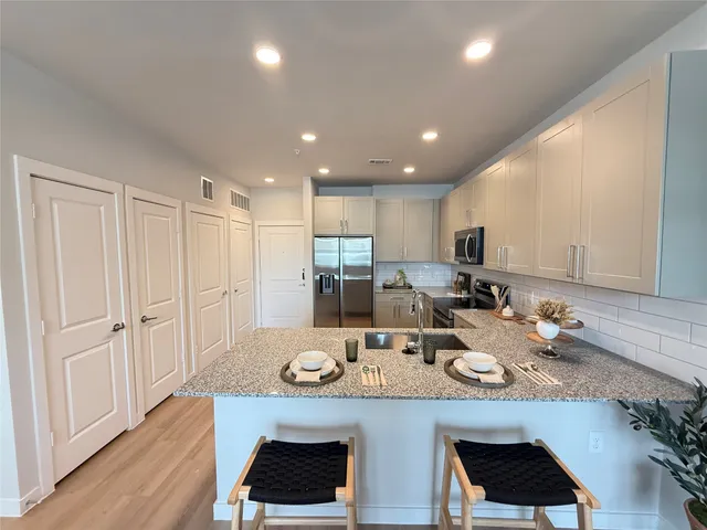 a view of a dining room with furniture