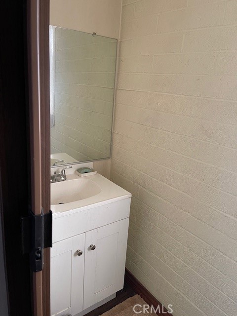 13127 East Ave W 11 Pearblossom, CA 93553 - Photo 13 of 23 a bathroom with a sink toilet and vanity