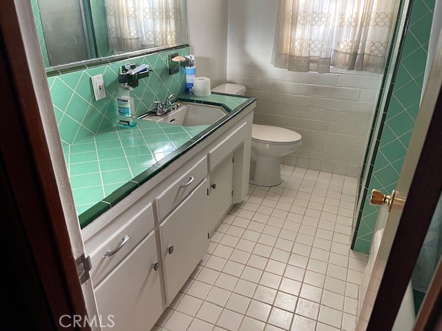 13127 East Ave W 11 Pearblossom, CA 93553 - Photo 14 of 23 a bathroom with a granite countertop shower and a sink