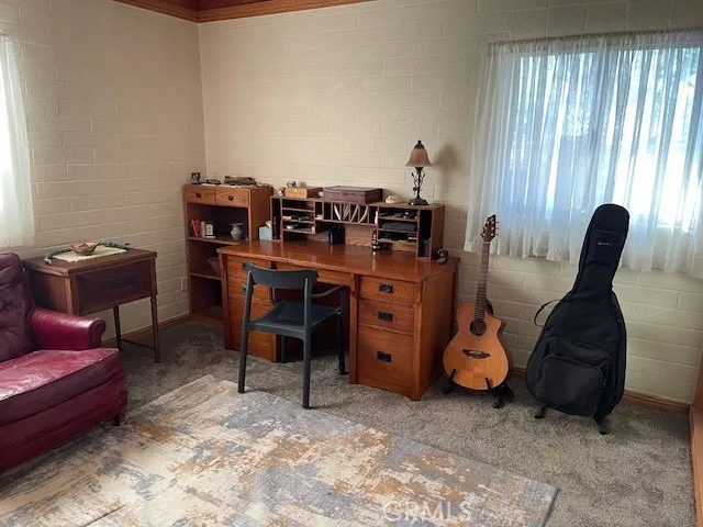 a bed sitting in a bedroom with a mirror