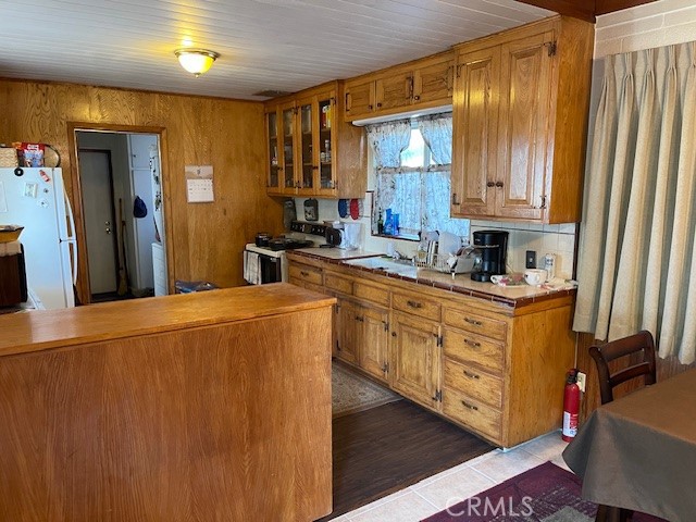 13127 East Ave W 11 Pearblossom, CA 93553 - Photo 10 of 23 a kitchen with sink a refrigerator and cabinets