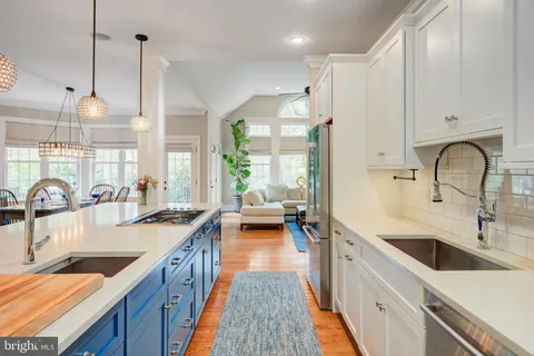 a kitchen with stove cabinets and refrigerator