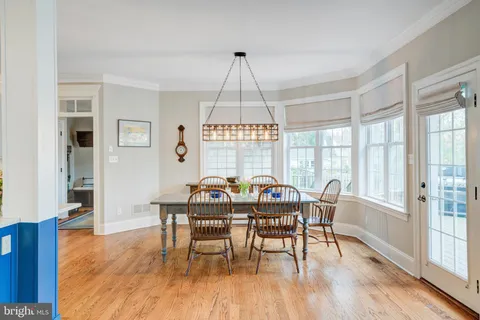 a bathroom with a double vanity sink a mirror and a shower
