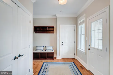 a spacious bathroom with a granite countertop sink and a mirror
