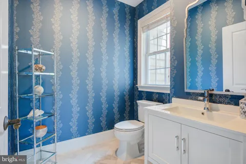 a bathroom with a double vanity sink mirror and shower