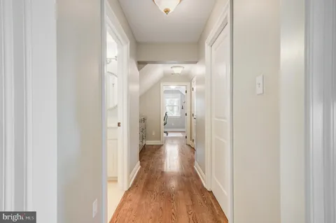 a workspace with furniture hardwood and a window