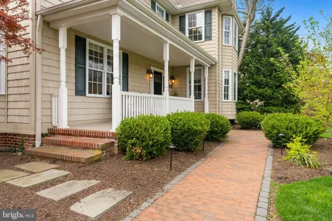 a view of a house with potted plants