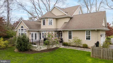an aerial view of a house with a yard and garden